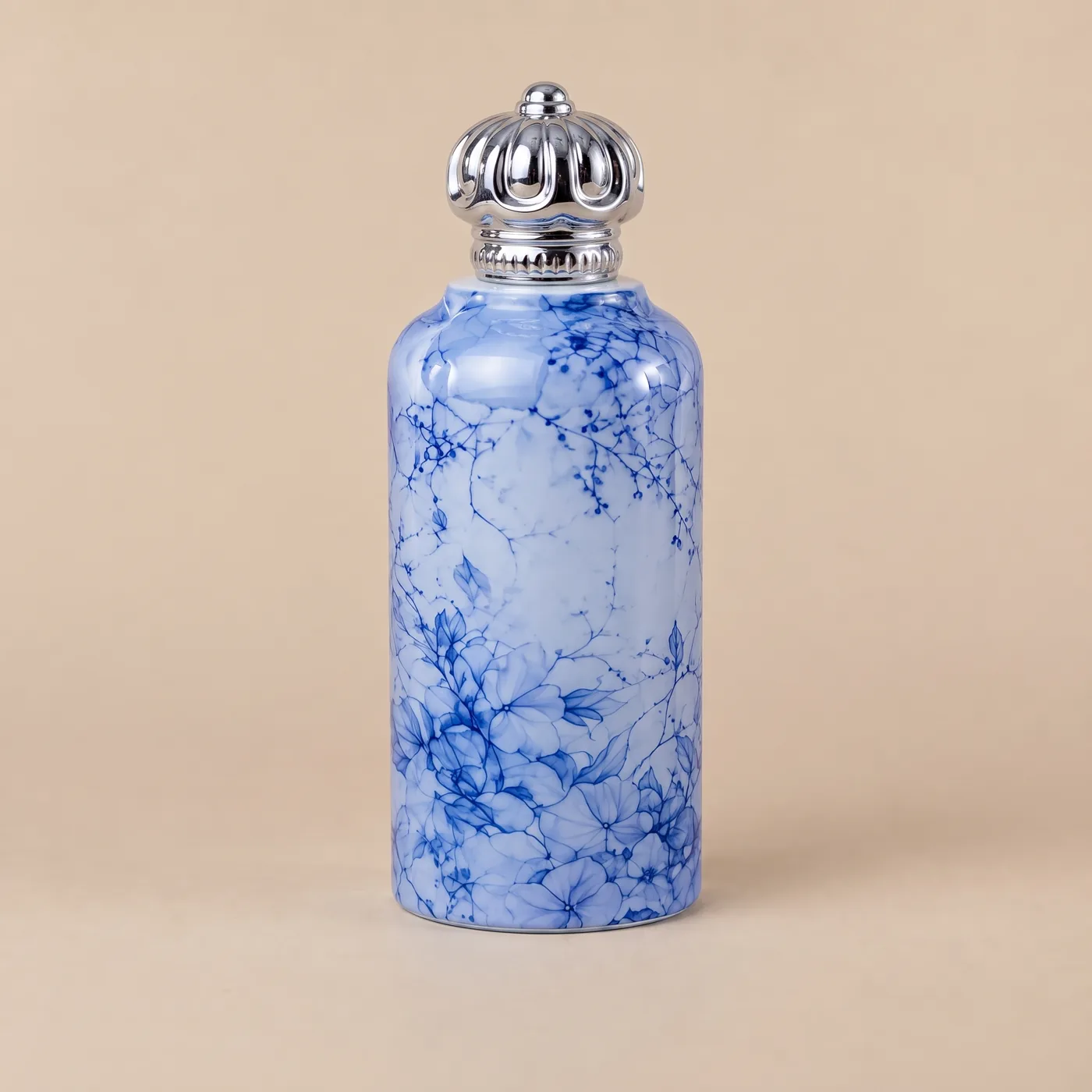 Blue decorated bottle with a sculpted silver closure concept